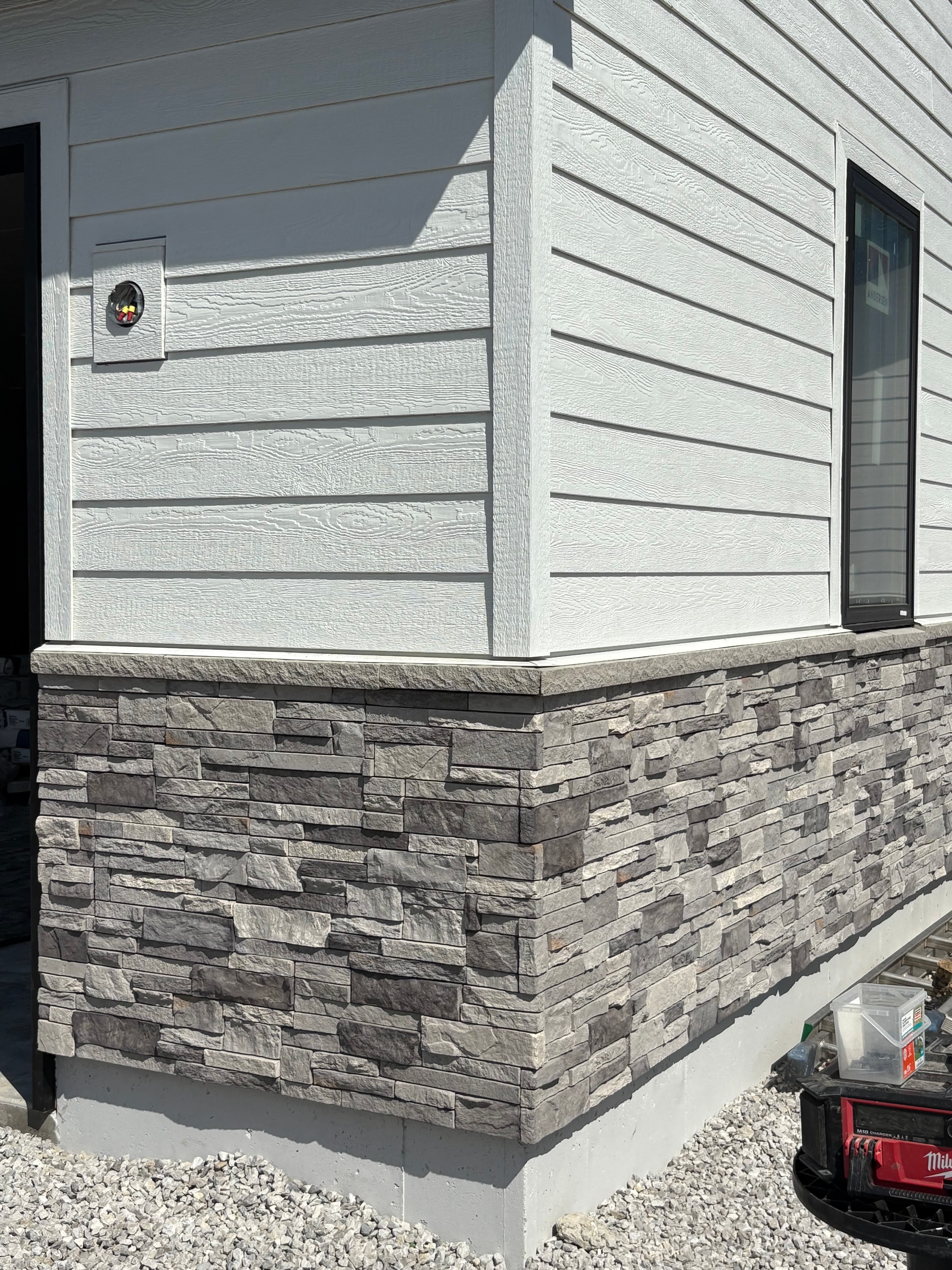 Stacked Ledgestone To Board Batten Detail